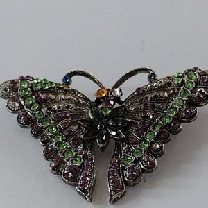 Elegant Butterfly Brooch with Green and Purple Accents